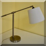 D08. Silvertone adjustable desk lamp. 19”h x 24”w - $32 